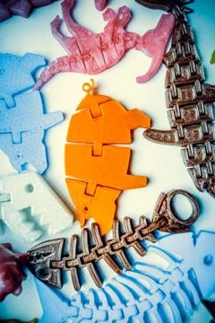 Many bright multi-colored objects printed on 3d printer lie on flat surface Stock Photos