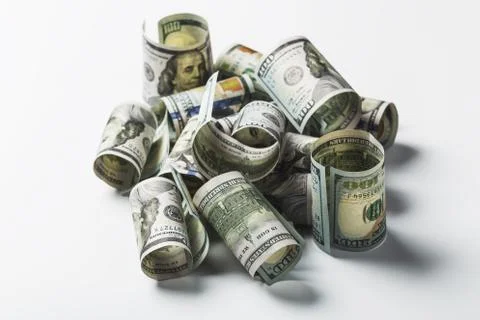 Many bundle of US 100 dollars bank notes isolated on white background Stock Photos