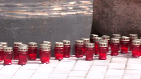 Many burning candles in the cemetery Video stock 316515670