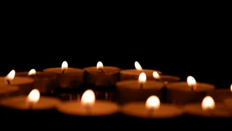 Many burning candles in dark. Stock Footage 125982950