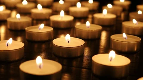 Many burning candles. Many burning candles shining in the dark. Stock Footage 224106506