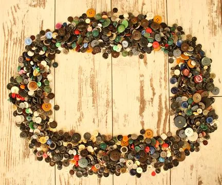 Many buttons of different size and color in a small wooden box Stock Photos