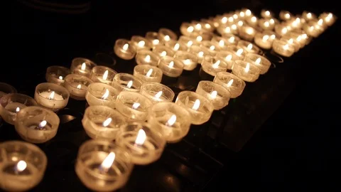Many candle flames glowing in the dark. For memorial events. Stock Footage 103383801