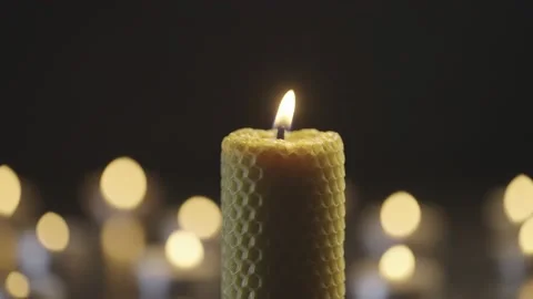 Many candles burn in the dark. Stock Footage 232372544