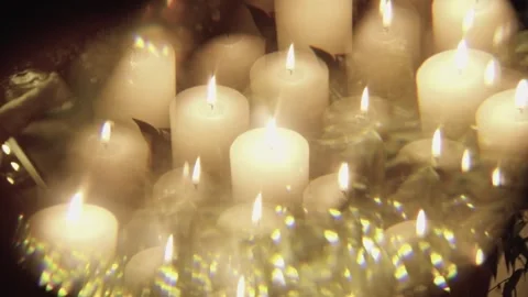 Many candles burn in the dark. Stock Footage 257120562