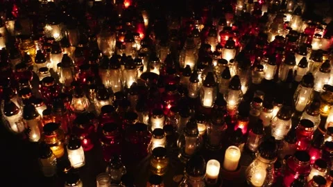 Many candles burning on the grave. Video stock 233970328