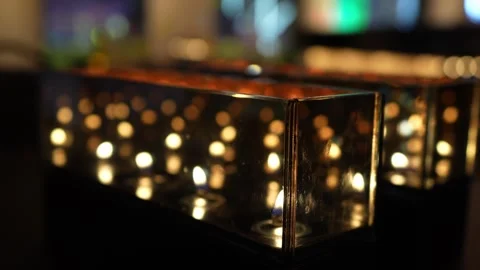 Many candles glowing reflection at bar Stock Footage 244963941