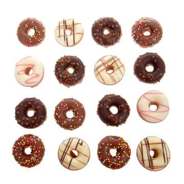 Many candy coated mini donuts top view isolated on white background. Flat lay Foto stock