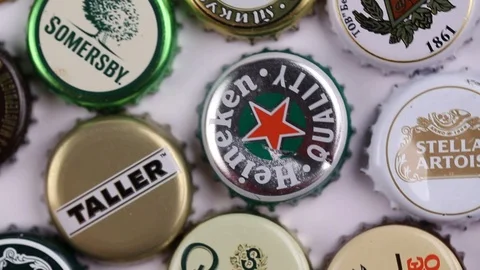 Many caps of beer of different varieties. the covers are inscribed up Stock Footage 123775000