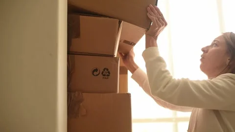 Many cardboard boxes are stacked on top of each other. Stock Footage 243170485