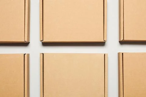 Many cardboard boxes on white background, flat lay. Packaging goods Foto stock