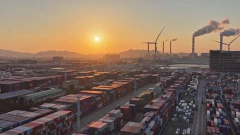 Many cargo delivery container at port near wind turbines plant. Renewable energy 库存影片 334125704
