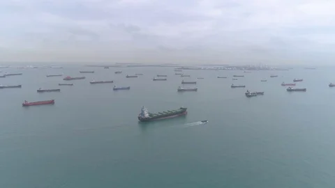 Many cargo ships in the sea Aerial Stock Footage