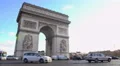 Many cars driving by Arc de Triomphe in sunlit Place Charles de Gaulle in Paris 4k or 4k+ Resolution