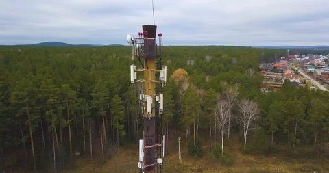 Many cellular antennas on the pipe. Flying around the tube quadcopter. Stock Footage 120107865