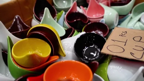 Many ceramic soup spoons arranged together Stock Footage 320958723