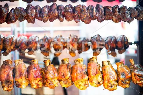 Many chickens on the spit Stock Photos