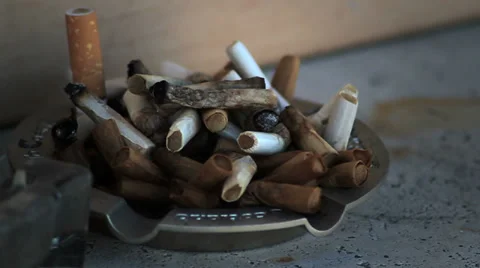 Many cigarettes in ashtray Stock Footage 33622140