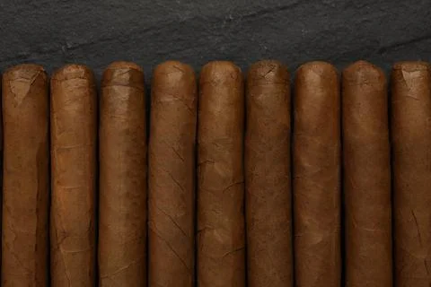 Many cigars on black table, flat lay 스톡 사진
