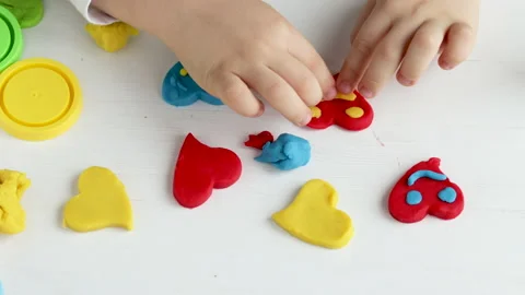 Many clay plasticine colorful hearts on table Stock-Footage 226311341