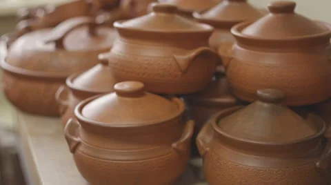 Many clay pots on the table pottery. RAW video record Видео 61327242