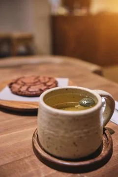 Many coffee cup on table soft focus, glazed ceramic dishes stand on a shelf in Stock-Fotos