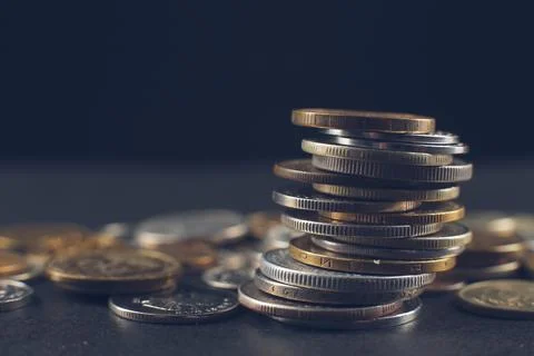 Many coins on a black background. Stack of coin Stock Photos