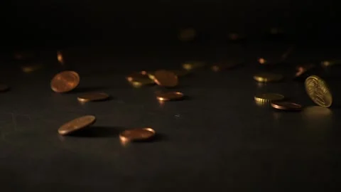 Many coins fall down on a dark table Stock Footage 160561935