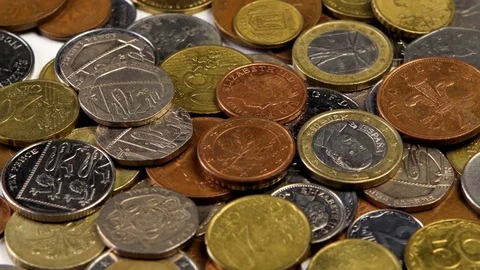 Many coins spin on the table Stock Footage 82483584
