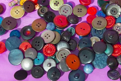Many colored and different size buttons. Top view. Stock Photos