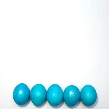 Many colored blue easter eggs isolated on the white background. Stock Photos