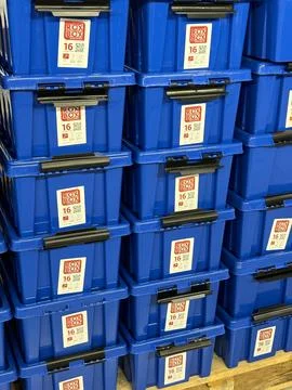 Many colored blue plastic crate. Blue empty plastic storage boxes for sale in Stock Photos