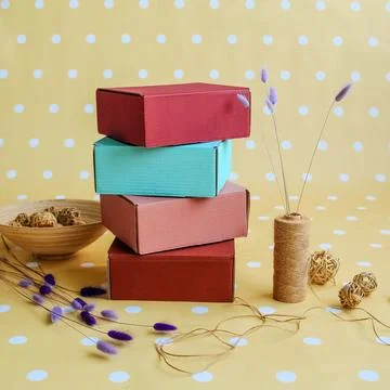 Many colored boxes in festive decor. Place for text and logo. The concept o.. Stock Photos