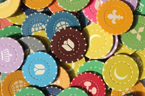 Many colored chips backdrop. Lot multicolor assorted gambling playing chips s Foto stock