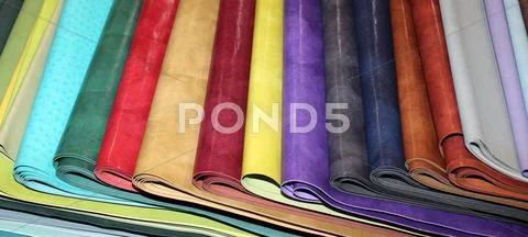 Many colored faux leather pieces for sale in the workshop Stock Photos