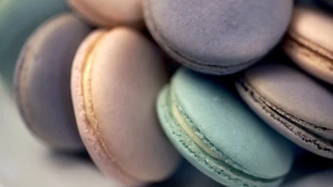 Many colored macaroon beautifully arranged on a plate close-up Video stock 70754429