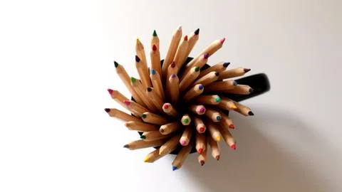 Many Colored Pencils in Black Mug with Shadow with White Space Stock Photos