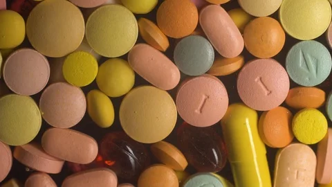 Many colored tablets are moving Stock Footage 127620315