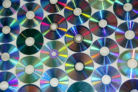 Many colorful compact discs creating shiny iridescent background.retro CD o.. 스톡 사진