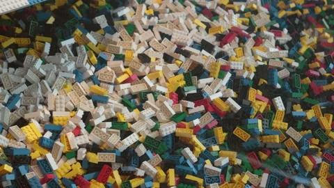 Many colorful pieces of plastic constructor, disassembled blocks Stock Footage 231138373