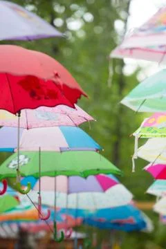 Many colorful umbrellas in the park Stock Photos