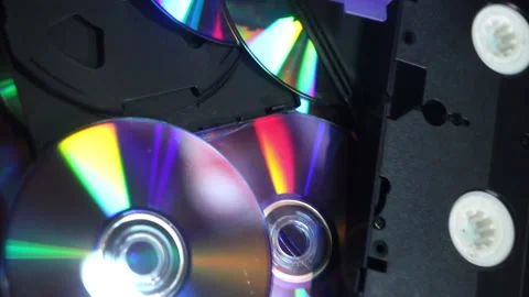 A many compact discs and some hi-8, vhs and dv-cam video casettes Stock Footage 203811876