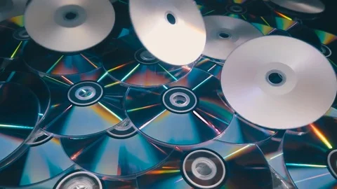 Many compact discs lying on top of each other rotate Stock Footage 82716501
