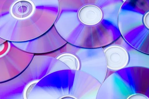Many Compact Discs scattered seen from above Stock Photos
