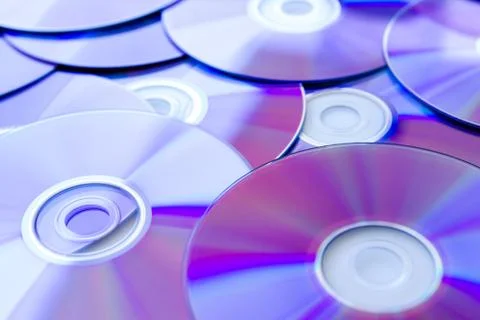 Many Compact Discs scattered seen up close Stock Photos
