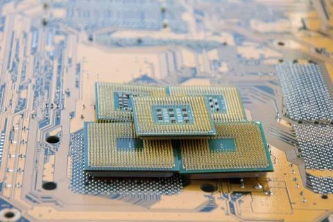 Many computer CPU close-up on the motherboard background, socket of central p Stock Photos