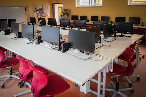 Many computers are in a computer cabinet in a school Stock Photos