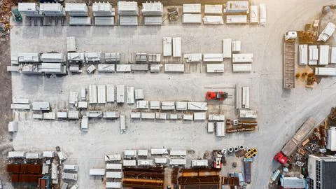 Many concrete blocks of different sizes stand in warehouses, the production o Stock Photos