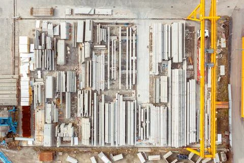 Many concrete blocks of different sizes stand in warehouses, the production o Stock Photos