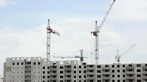Many of cranes. Tower cranes against blue sky, with clouds. Stock Footage